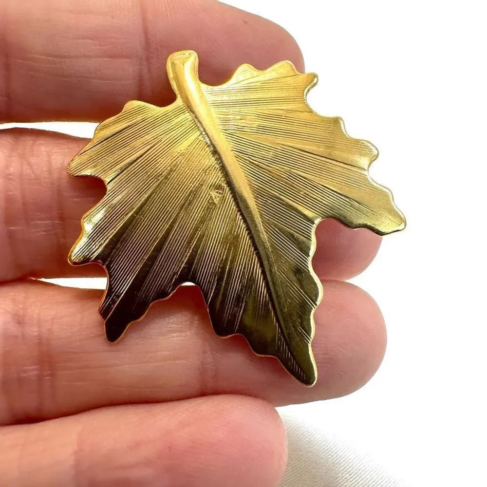Gold tone leaf pin
